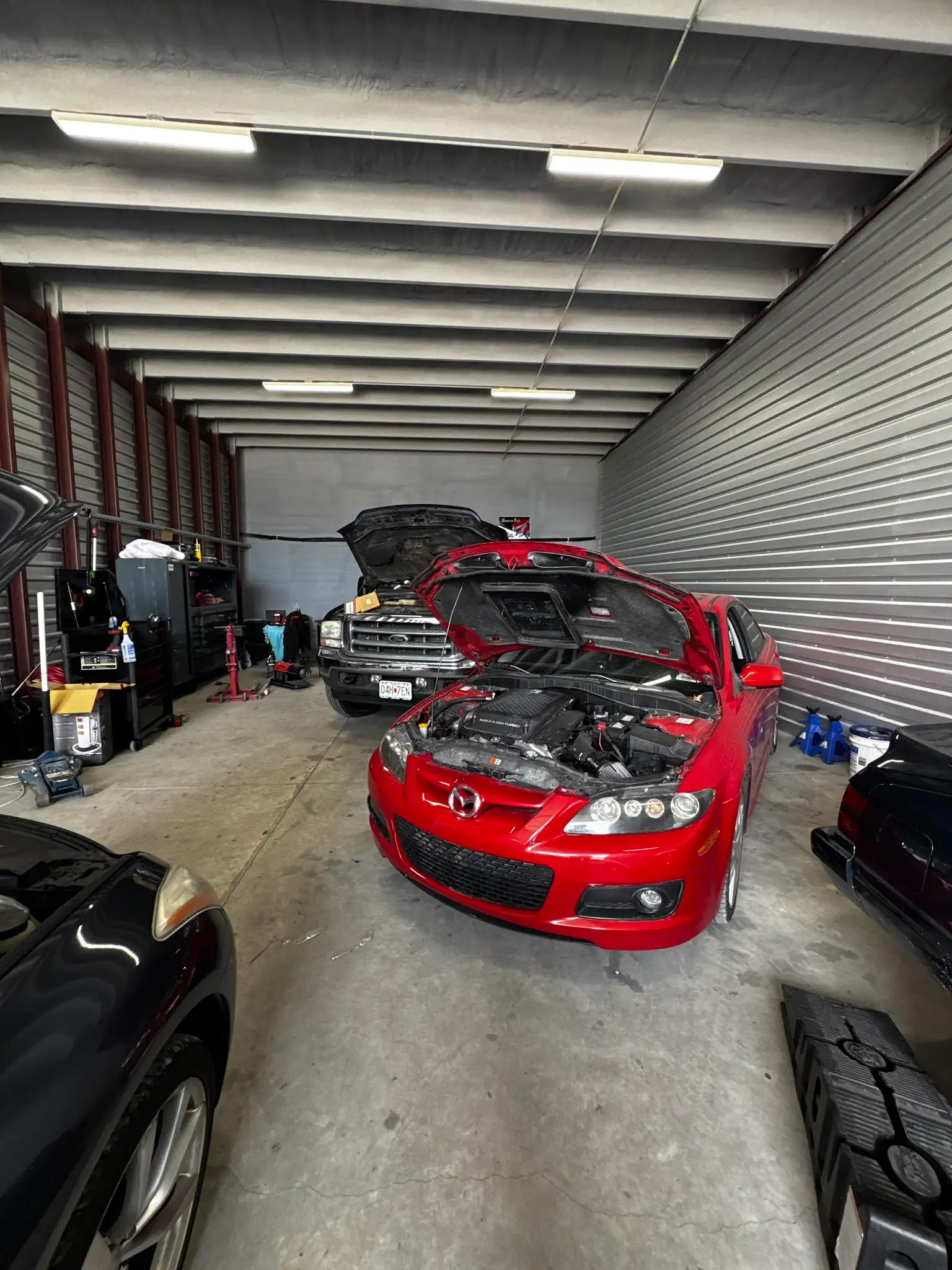 Chapman Automotive shop interior with vehicles